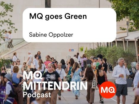 A crowd in a square in front of a building with signs reading “MQ goes Green Sabine Oppolzer” and “MQ MITTENDRIN Podcast”