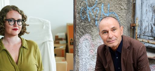 Two people, one standing in a room with boxes, the other leaning against a graffiti-covered wall next to a window with peeling paint.