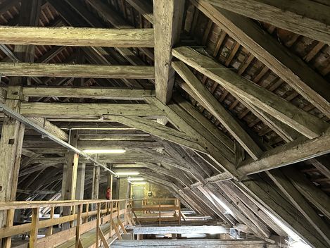 Wooden beam construction of an old roof truss.