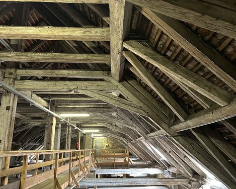 Wooden beam construction of an old roof truss.