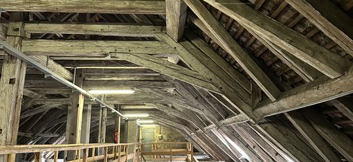 Wooden beam construction of an old roof truss.