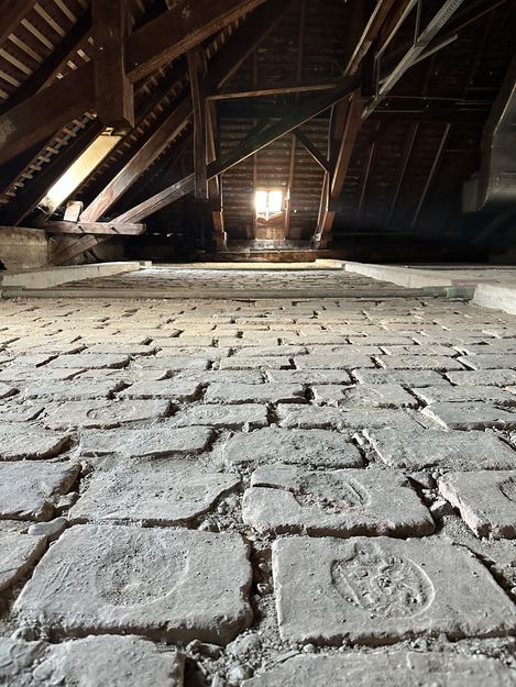 Interior view of a roof truss with tiles and masonry