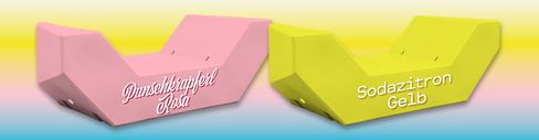 Two pink and yellow Enzis with the inscriptions ‘Punschkrapferl Rosa’ and 'Sodazitron Gelb'