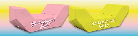 Zwei rosane und gelbe Enzis mit den Aufschriften 'Punschkrapferl Rosa' und 'Sodazitron Gelb'