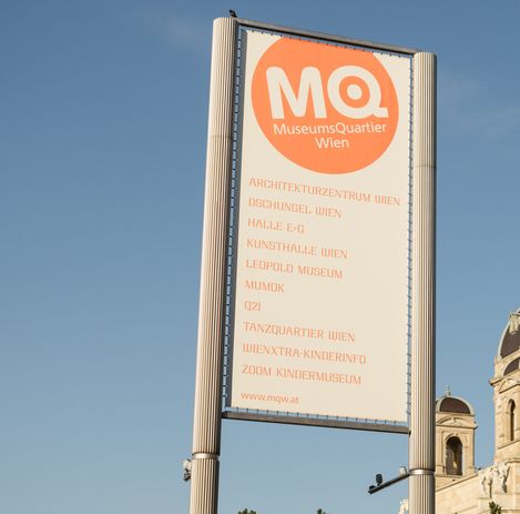 View of an MQ sign listing all MQ institutions.