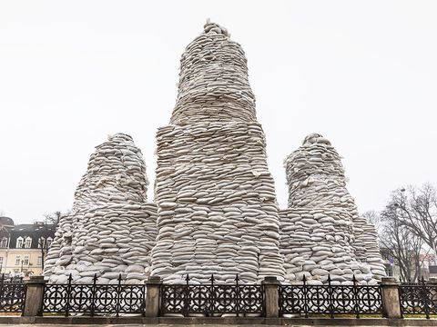 The monument to Princess Olga in the centre, with the Apostle Andrew on the left and St Cyril and St Methodius on the right, protected by sandbags, Kyiv, Ukraine