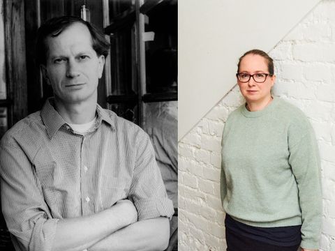 Two people, one in black-and-white facing forward and the other in color standing sideways against a white brick wall
