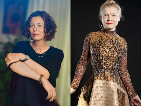 Two women, left with short curly hair wearing a black top, right in a patterned long-sleeve dress against a black background
