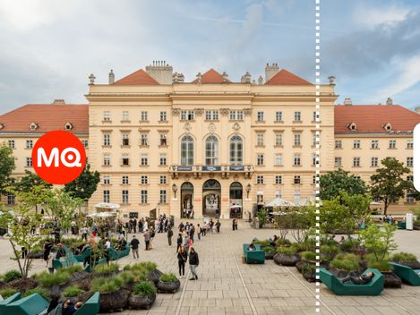 Frontansicht des Hauptgebäudes im MuseumsQuartier Wien mit Besucher:innen auf dem Platz davor.