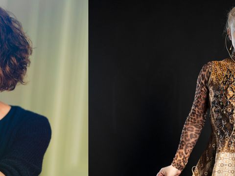 Two women, left with short curly hair wearing a black top, right in a patterned long-sleeve dress against a black background