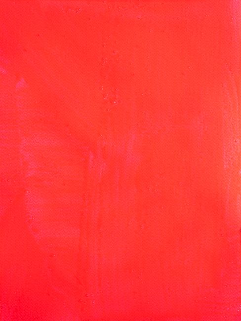 surface painted red with wide brush strokes