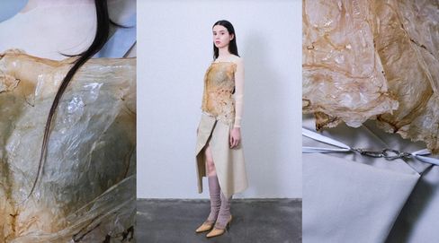 Woman standing against white wall wearing beige asymmetrical dress with transparent long-sleeve top, boots and socks, close-ups of the transparent shiny material of the top on left and right.