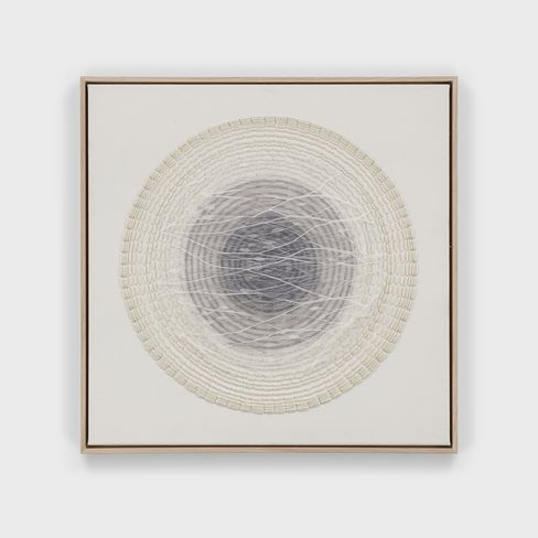 Artwork with concentric circles of woven and drawn lines in gray tones and white in a narrow wooden frame
