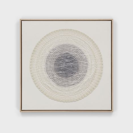 Artwork with concentric circles of woven and drawn lines in gray tones and white in a narrow wooden frame