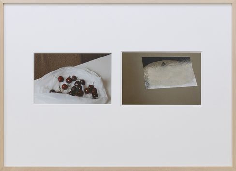 Two photographs side by side in a white frame, left showing a close-up of cherries on white fabric, right showing a shiny silver rectangular surface on a dark background.