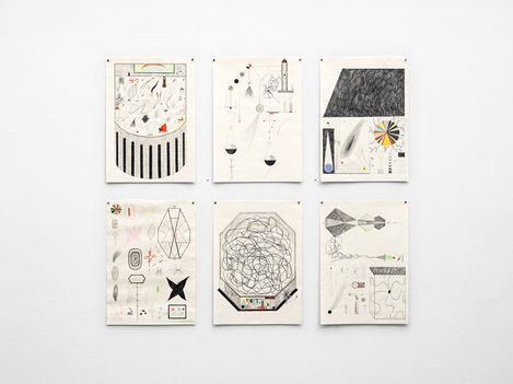 Six abstract drawings with geometric shapes and lines arranged in two rows on a white wall.