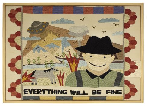 Embroidered artwork showing a landscape with mountains, burning trees, a flying saucer, a smiling man wearing a hat, and the text "EVERYTHING WILL BE FINE".