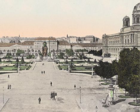 View of Maria-Theresien-Platz in Vienna with the monument in the centre, surrounded by symmetrically laid out gardens and large buildings on both sides, with the MuseumsQuartier Wien, formerly the Imperial Stables, behind it