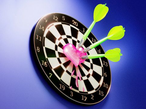 The picture shows a dartboard. In the centre is a heart that has been hit by three darts.