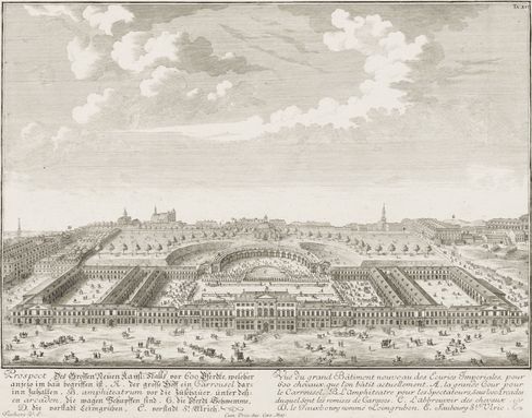 Black-and-white line drawing of the Imperial Stables, consisting of a large Baroque building complex with an inner courtyard and surrounding gardens, with a town featuring several church towers and a castle in the background