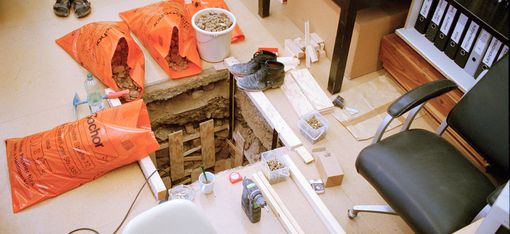 A shaft was dug into the floor of an office.