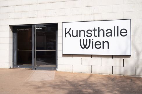 Entrance to the Kunsthalle Wien with a glass door and a light box displaying the words ‘Kunsthalle Wien’.