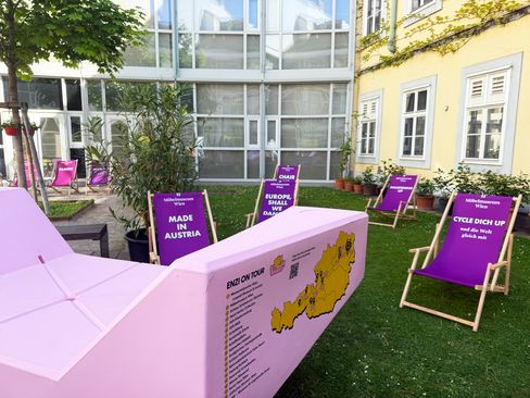 Close-up of a pink Enzi with a Möbelmuseum Wien “Design & History Vienna 2026” sticker.