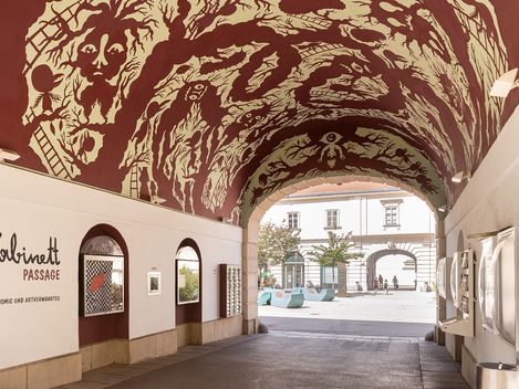 Arched passageway with painted vaulted ceiling and the inscription 'Kabinett Passage' on the wall