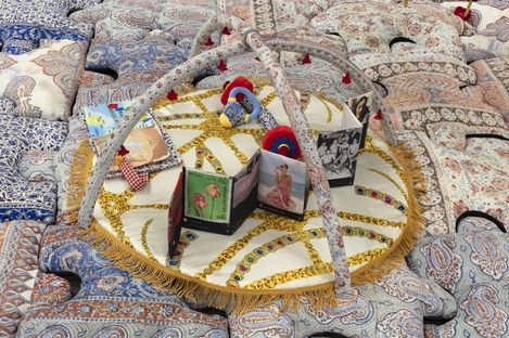 A sculpture by Chalisée Naamani featuring a fabric book.