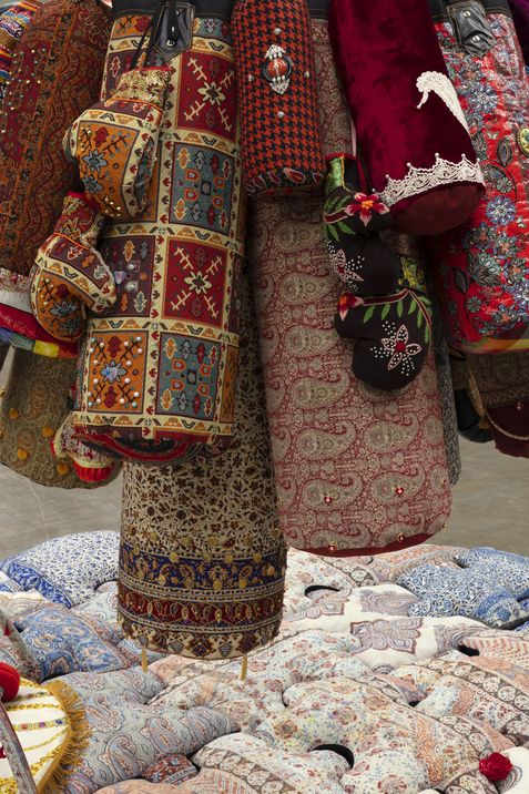 A sculpture by Chalisée Naamani made from punching bags with different patterns.