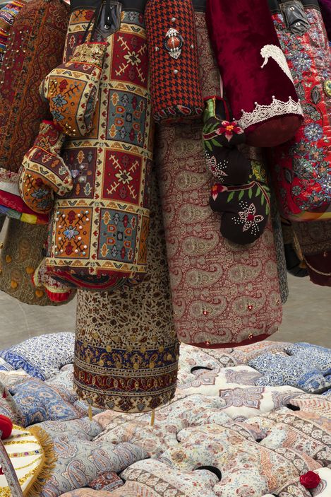A sculpture by Chalisée Naamani made from punching bags with different patterns.