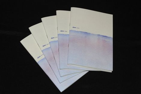 Five stacked booklets with white covers and a pale blue to violet gradient on a black background.