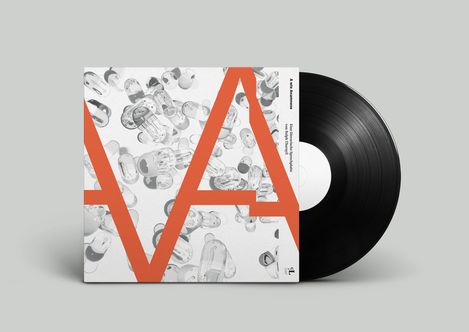 Vinyl record with white cover featuring a large orange A over a pattern of transparent capsules.