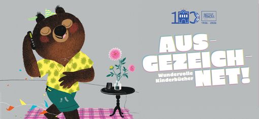 The picture shows a detail from a picture book illustration by Marc Boutavant. It depicts a bear wearing a yellow shirt and short green trousers, standing in front of a small table on a pink chequered rug. The bear is wearing a little party hat and looks as though he is thoroughly enjoying himself.