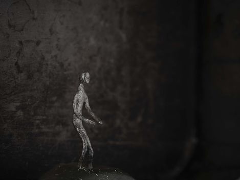 A figure against a dark background