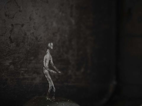 A figure against a dark background