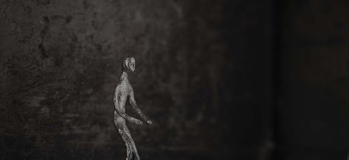 A figure against a dark background
