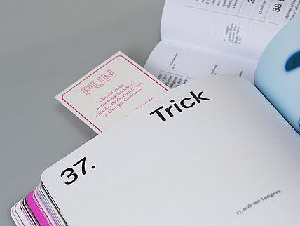 An open book showing a large Trick heading and page 37, with colorful tabs along the edge.