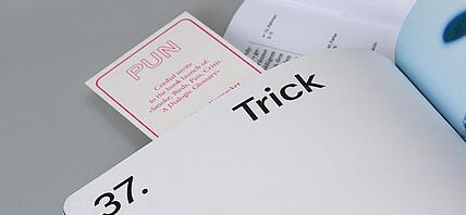 An open book showing a large Trick heading and page 37, with colorful tabs along the edge.