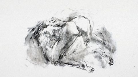 Black-and-white charcoal drawing of a reclining human figure bent forward with visible contours and shading