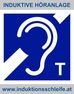 Blue pictogram with stylized white ear and letter T above text 'INDUKTIVE HÖRANLAGE' and below URL 'www.induktionsschleife.at'