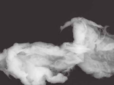White smoke or steam against a dark background.