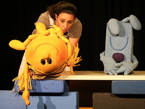 The two characters, Mr Grumpy and Miss Sunny, come across a female construction worker.