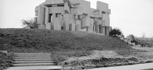 A black-and-white photograph of the Wotruba Church, made from concrete cubes.